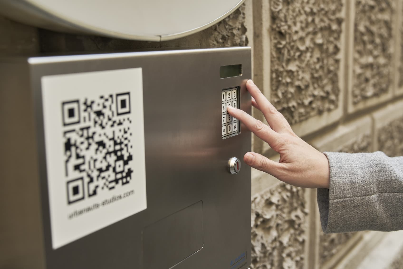 Check In Key safe, where a guest is typing in a code to retrieve the key