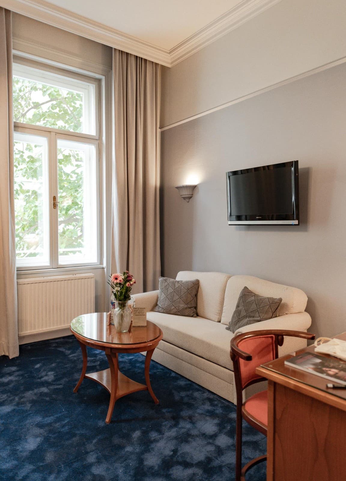 Take a break on your comfortable couch and rest after a long day. In the picture the couch is located in the back on the right side of the room facing the bed.