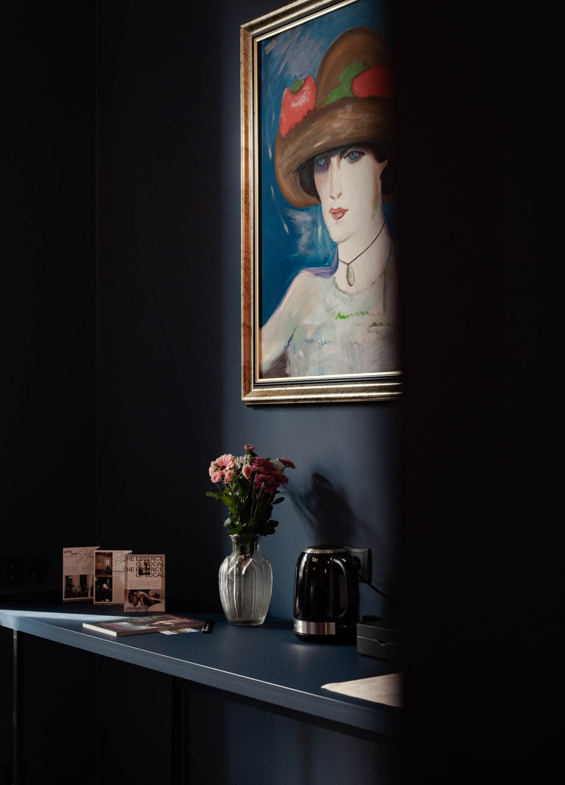 Pictured is a room detail of the art pieces, that show a woman from the late 20s and it compliments the art deco style, that is shown throughout the hotel.