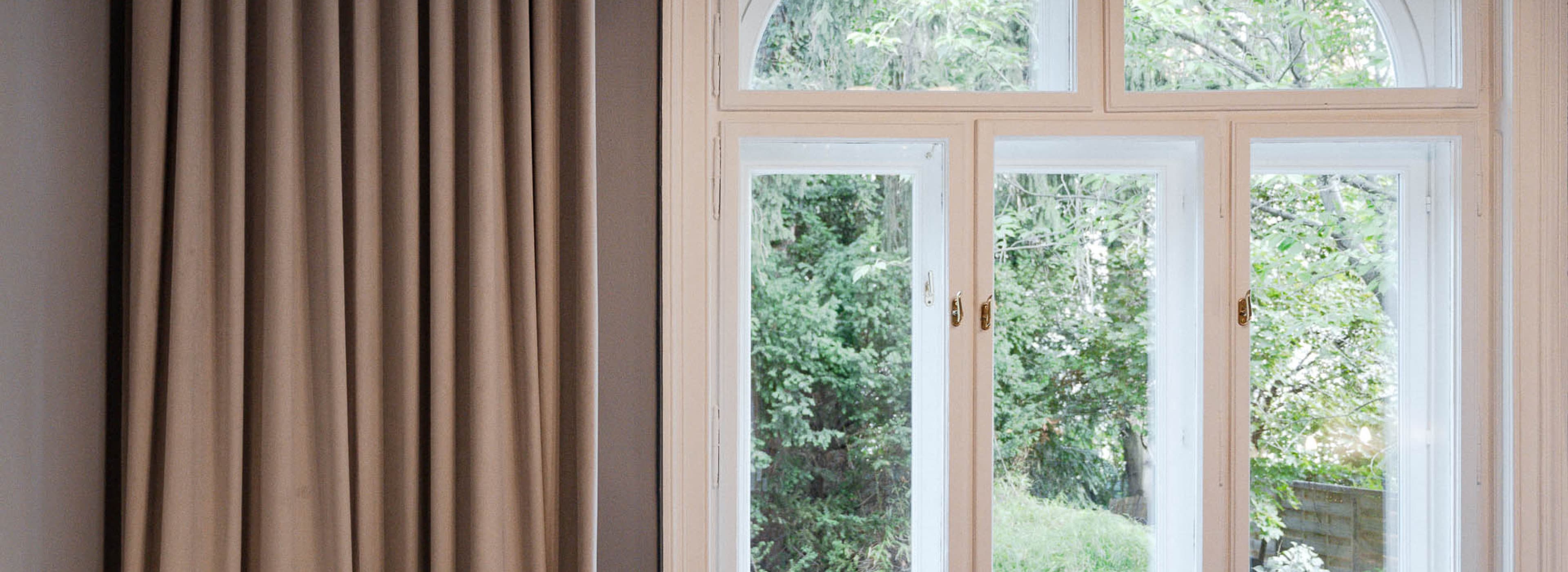 Waking up and enjoying a tranquil view into the garden! In our Chic Garden View category guests can enjoy, just like seen on the picture, the view into the garden.