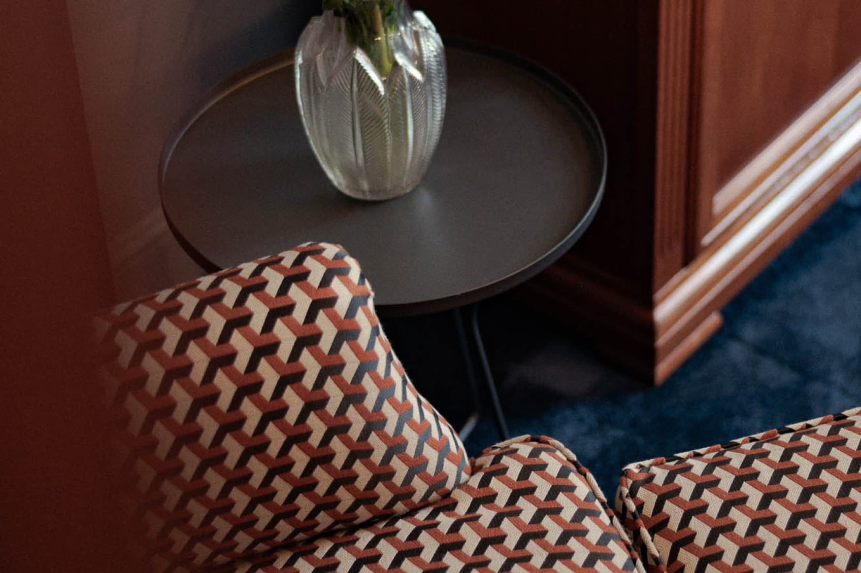 Shown is a detail picture of a beautifully restored armchair, that invites the guests to relax and enjoy the villa after a long day.